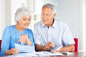 couple at table with calculator