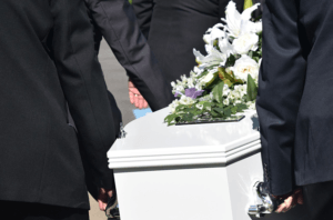 pallbearers carrying coffin