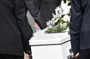 pall bearers carrying coffin