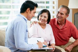 Financial Advisor Talking To Senior Couple