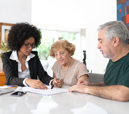 agent explaining to senior couple