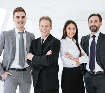 Three men in a suit with a woman in a suit