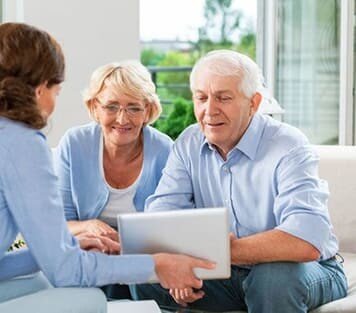 Senior couple looking at tablet