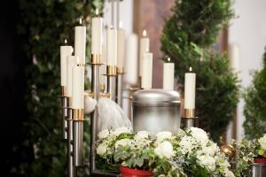 Funeral urn surrounded by candles